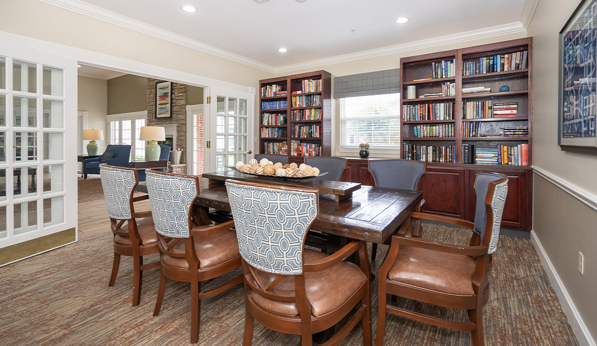 A modern dining room showcasing a table with chairs, ready for family gatherings.
